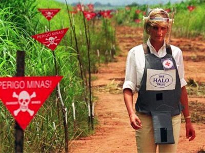 Princess Diana walks through a minefield in Angola while wearing PPE in 1997