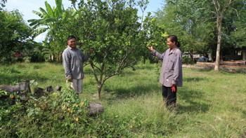 Two farmers in their field in Cambodia