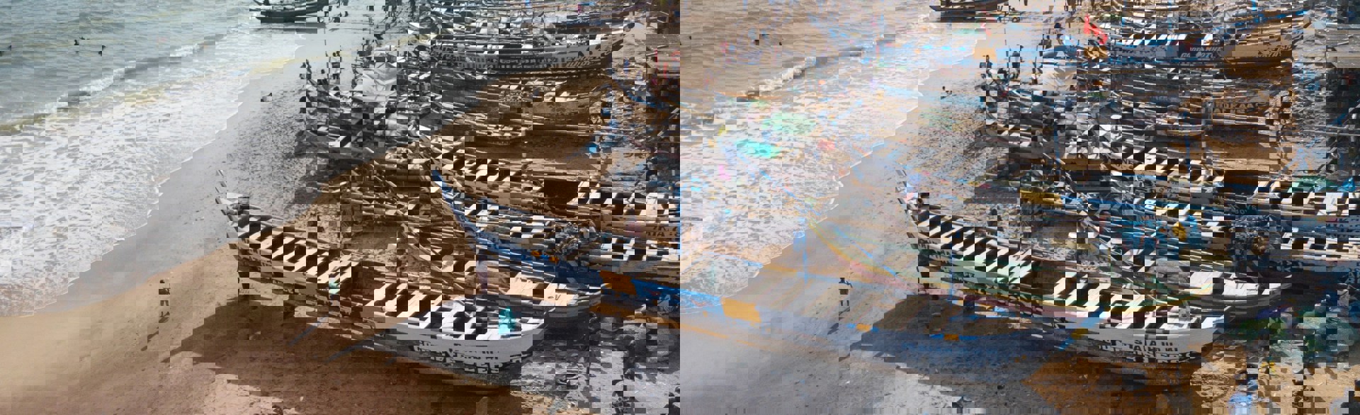 Small wooden boats on the sea in Ghana