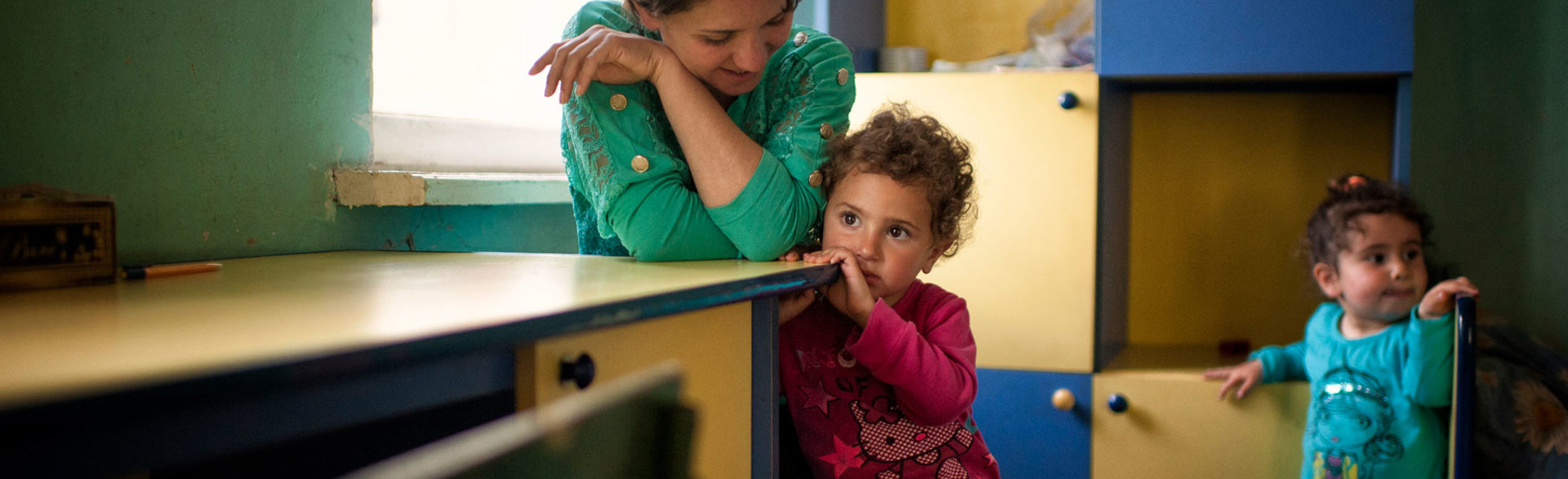 Two small children and an adult in a school in Nagorno Karabakh