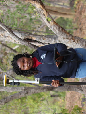 Delight Manyange, GIS Specialist, uses specialist technology to detect landmines