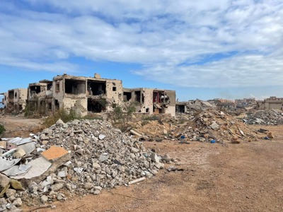 A destroyed building surrounded by rubble in Sirte, Libya
