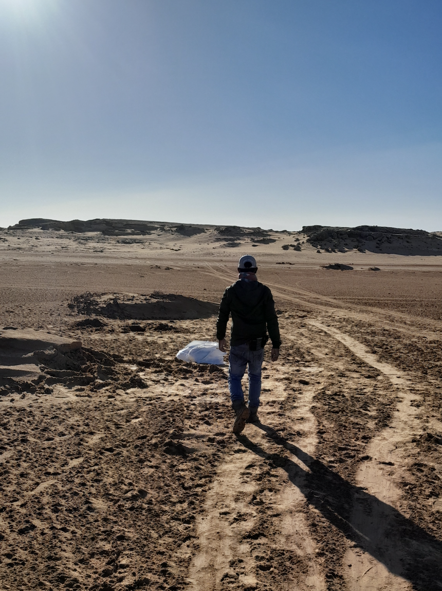 A man walks through desolate land in Mauritania 