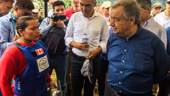 United Nations Secretary, General António Guterres, stands with a HALO staff member