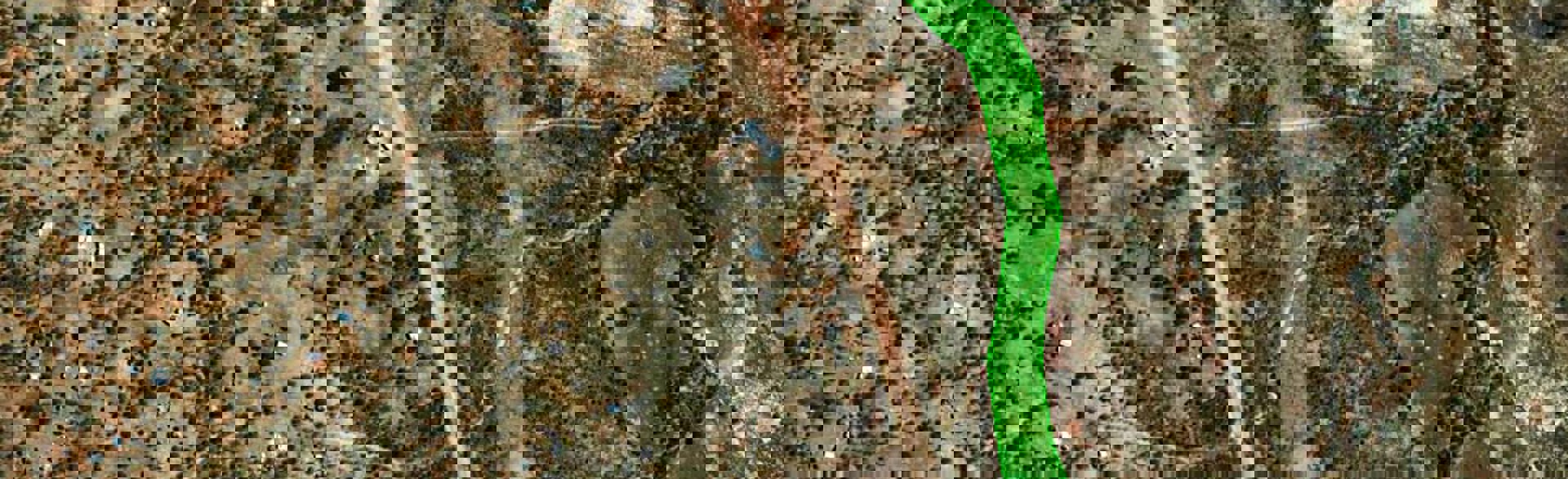 Satellite image highlighting a footpath running through a minefield