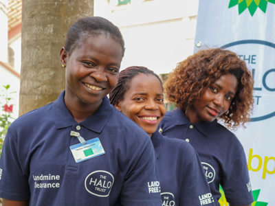 Portrait of three female deminers at the BP Angola grant signing event in Luanda