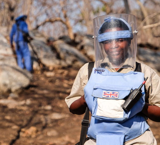 Supervisor, Angelina Chioko, wears her PPE in a minefield