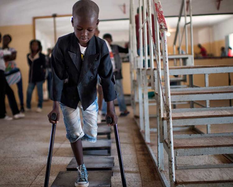 Eight year old Manuel, is missing a leg. He walks on crutches at a rehabilitation centre in Angola
