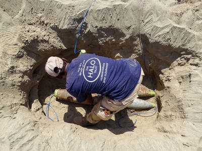 A HALO deminer prepares a hole filled with rockets for demolition in the frontline city of Taiz, Yemen