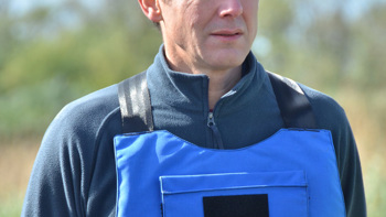 HALO CEO, James Cowan, wearing PPE on a minefield in Ukraine