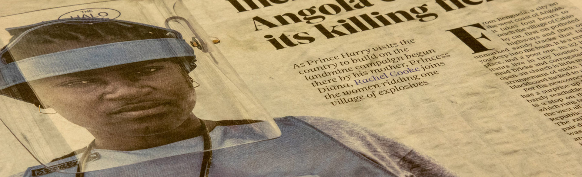 A newspaper with a photo of a HALO Trust deminer in Angola, along with a story about Prince Harry's visit to the country